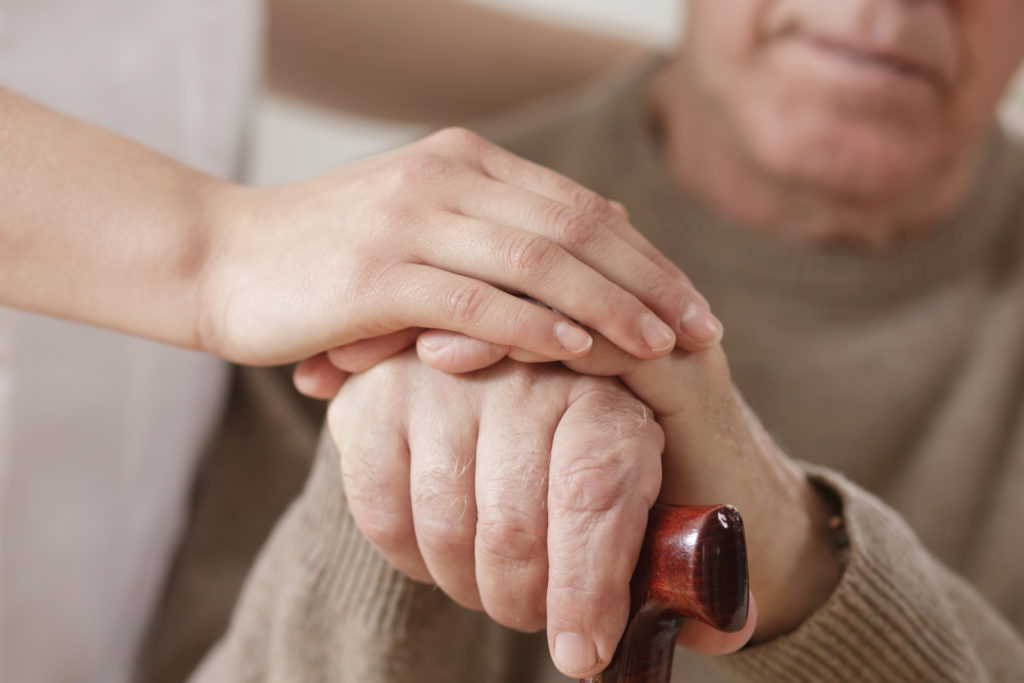 people holding hands volunteer manager Our care volunteer program Endless Journey Hospice Omaha Nebraska sit beside me program