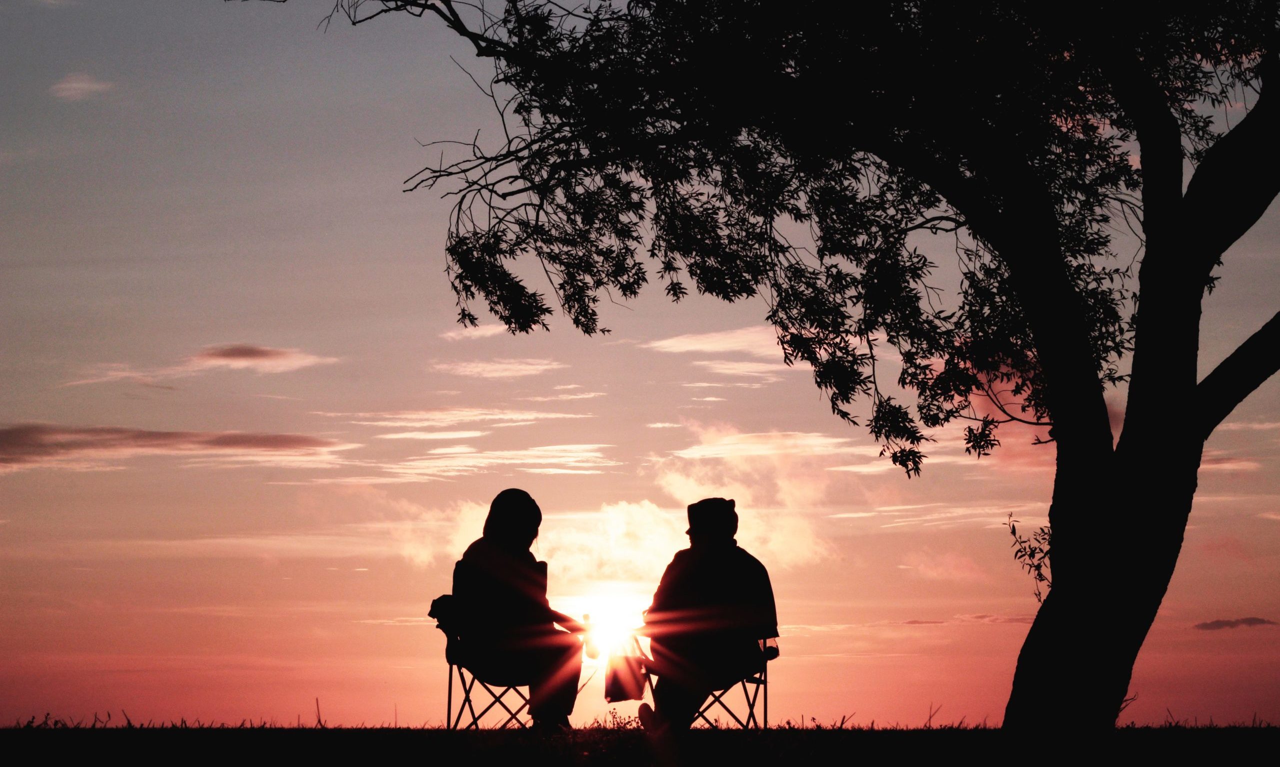 two people watching the sunset our care psychosocial support Endless Journey Hospice Omaha Nebraska